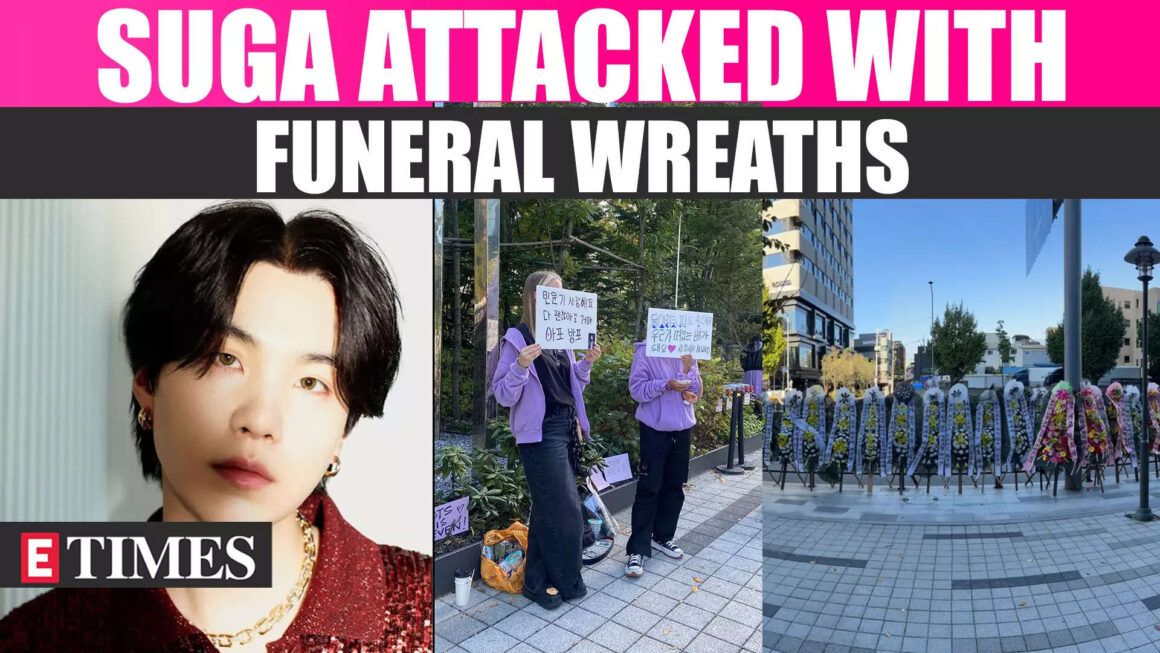 SUGA’s Anti-Fans Resurface, Label Him a ‘Criminal’, Disturbing Funeral Wreaths Line HYBE’s Building | Watch