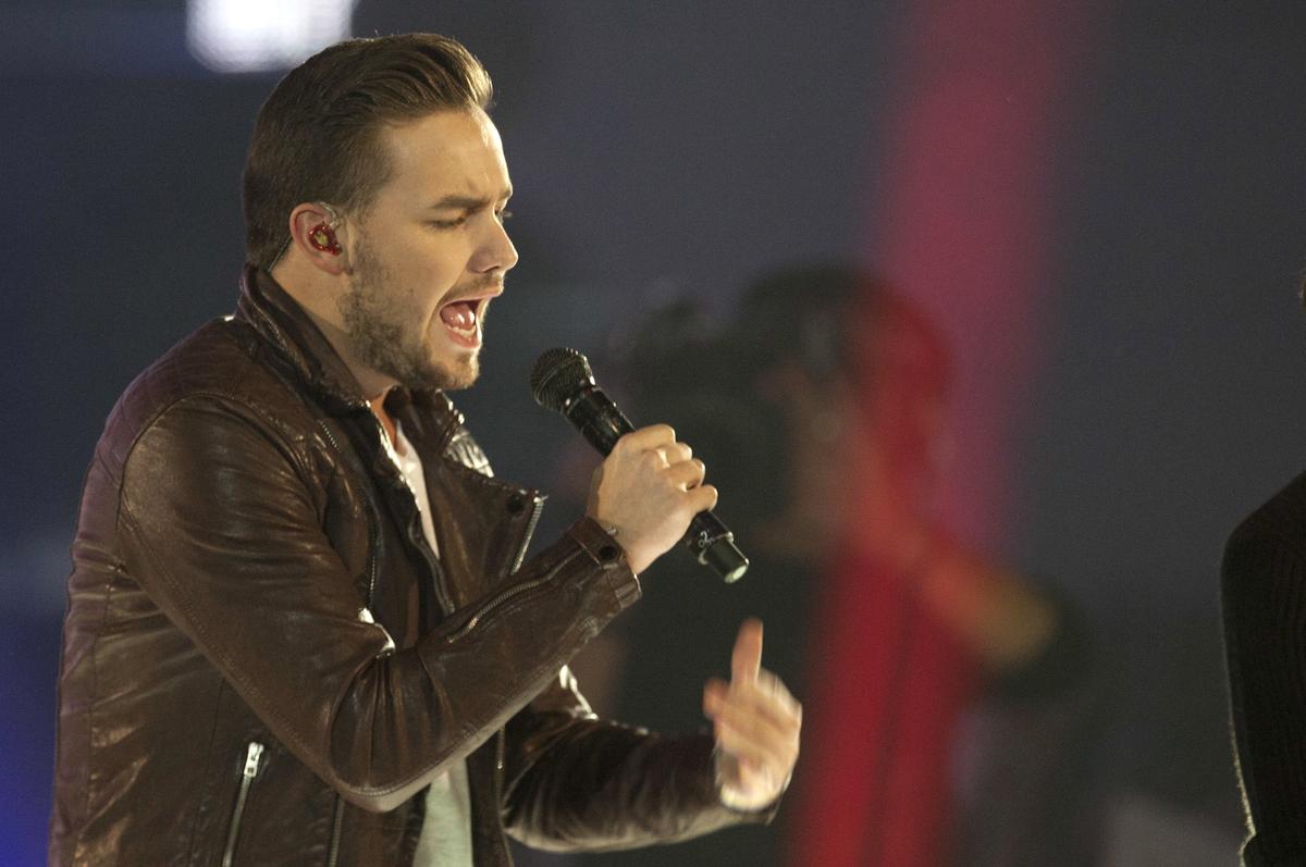 FILE - This is a Friday, Dec. 12, 2014 file photo of One Direction singer Liam Payne as he performs with the group, on stage during the ceremony of the ‘40 Principales Awards 2014’ at Palacio de los Deportes in Madrid, Spain.