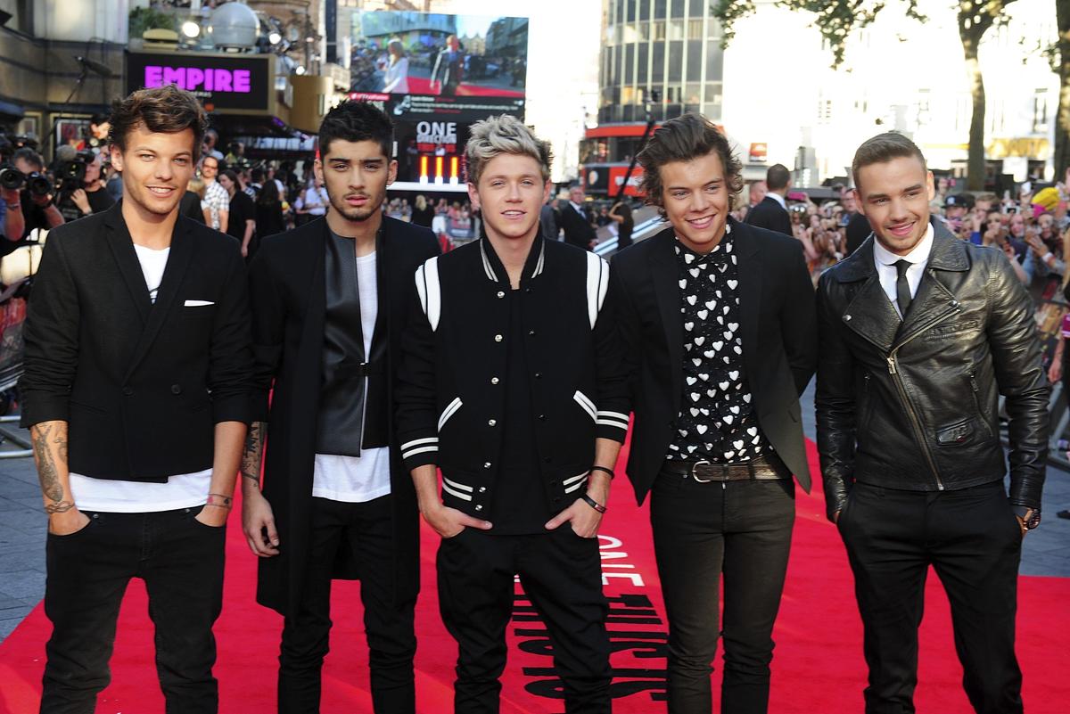 FILE - Louis Tomlinson, from left, Zayn Malik, Niall Horan, Harry Styles and Liam Payne arrive for the World Premiere of “One Direction: This Is Us,” at the Empire Leicester Square, in London, Aug. 20, 2013.