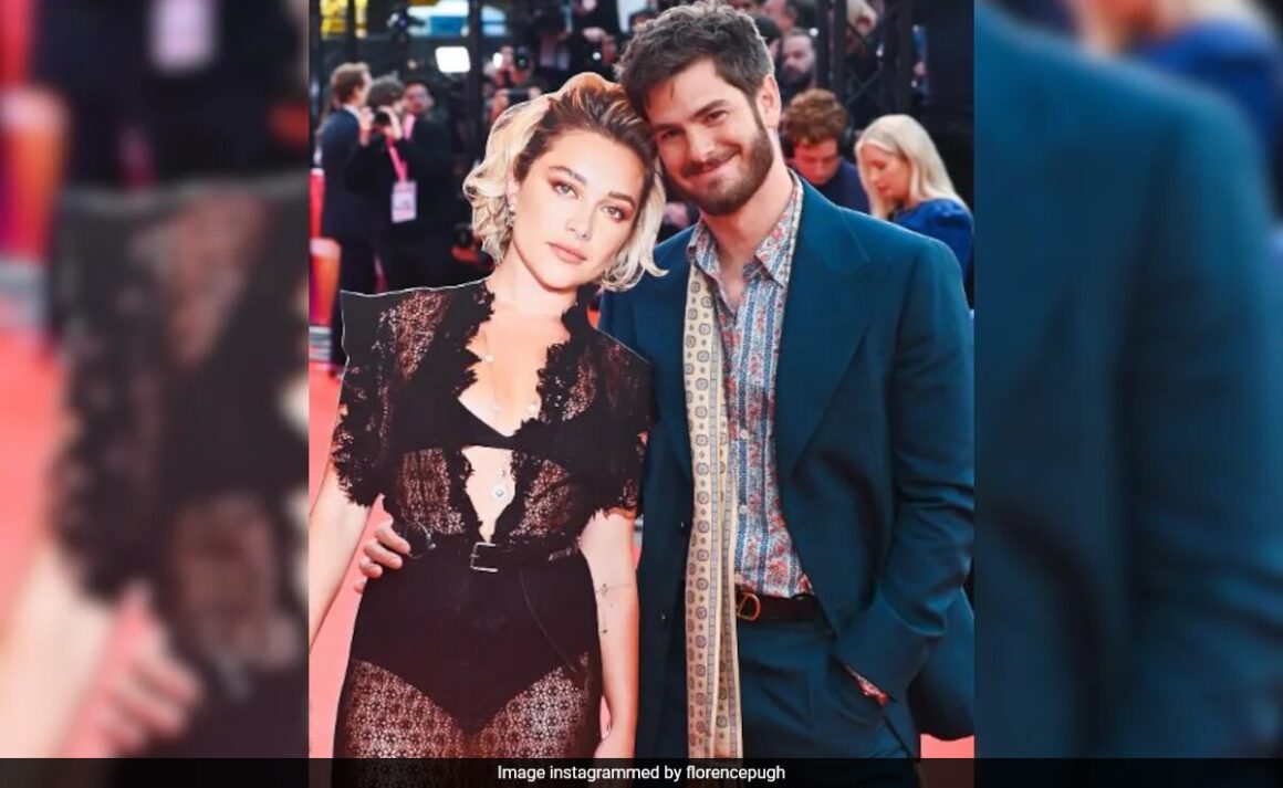 At We Live In Time Premiere, Andrew Garfield’s Plus One Was A Giant Cutout Of Florence Pugh. Talk About Chemistry