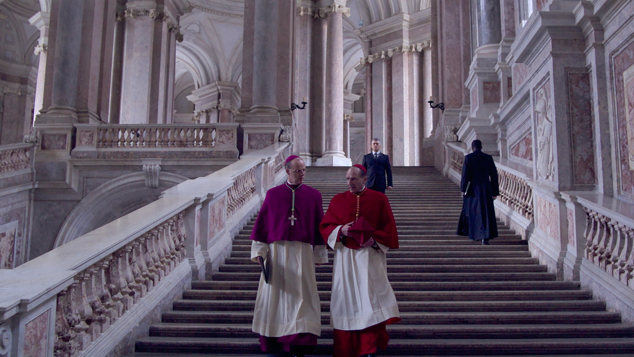 (L to R) Brían F. O'Byrne as Cardinal O'Malley and Ralph Fiennes as Cardinal Lawrence in director Edward Berger's 'Conclave', a Focus Features release. Credit: Courtesy of Focus Features. © 2024 All Rights Reserved.