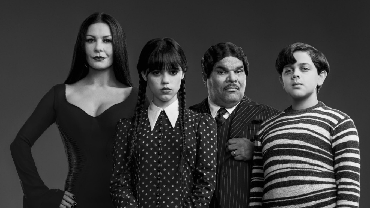 (L to R) Catherine Zeta-Jones as Morticia Addams, Jenna Ortega as Wednesday Addams, Luis Guzmán as Gomez Addams, and Isaac Ordonez as Pugsley Addams in Netflix's 'Wednesday.'