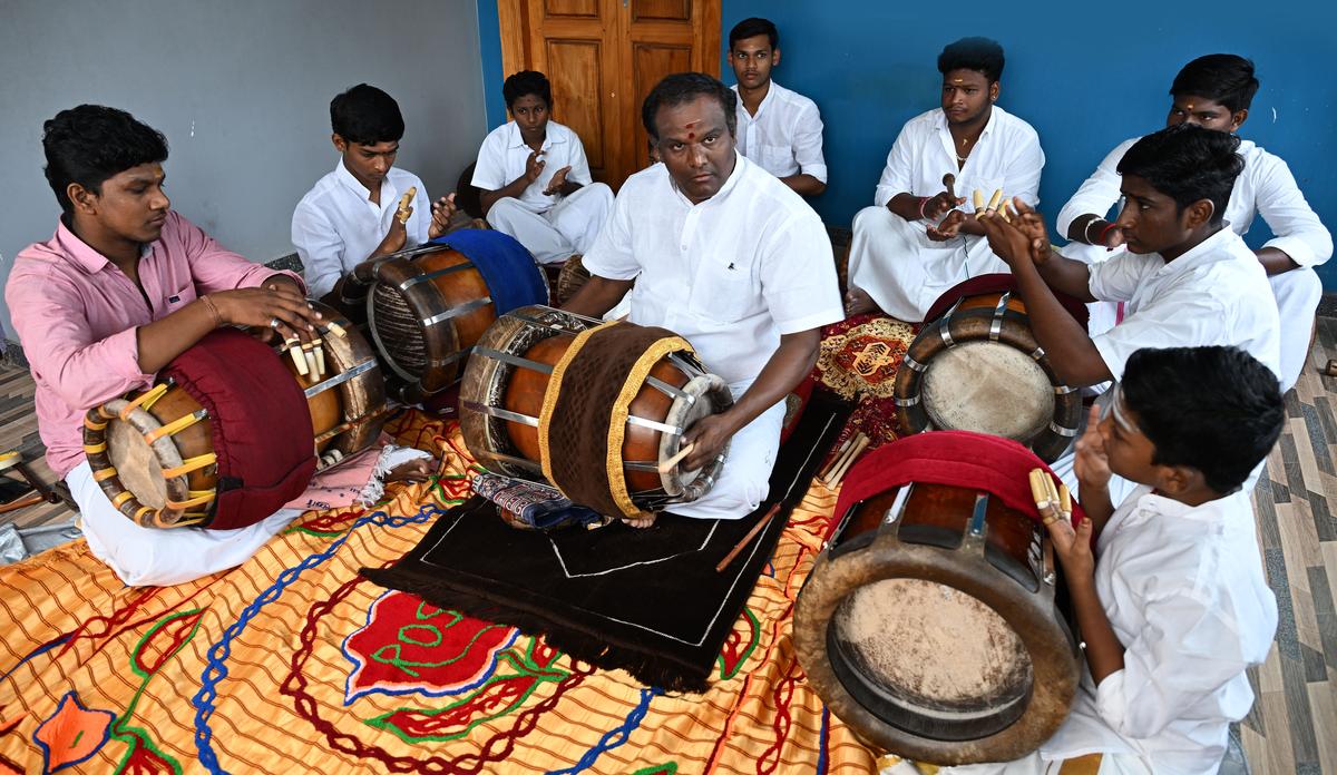 Thavil vidwan Thirurameshwaram T.B. Radhakrishnan with his students at the practice session in Thanjavur. 