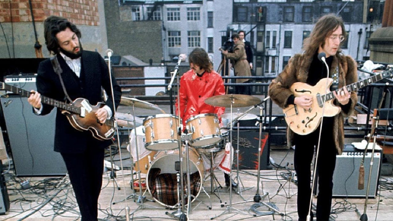 (L to R) Paul McCartney, Ringo Starr, and John Lennon in 'The Beatles: Get Back - The Rooftop Concert.'