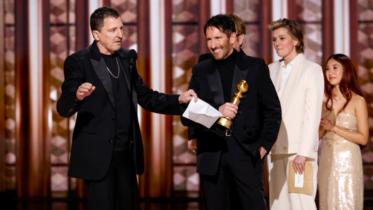 (L to R) Atticus Ross and Trent Reznor accepts the award for Original Score - Motion Picture at the 82nd Annual Golden Globe Awards, airing live from the Beverly Hilton in Beverly Hills, California on Sunday, January 5, 2025, at 8 PM ET/5 PM PT, on CBS and streaming on Paramount+. Photo: Sonja Flemming/CBS ©2025 CBS Broadcasting, Inc. All Rights Reserved.